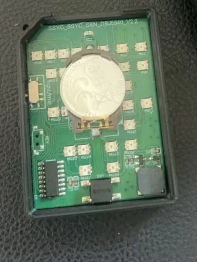 An assembled PCBA inside its enclosure, with the microcontroller, the LED array, the switches and the battery holder on the board.