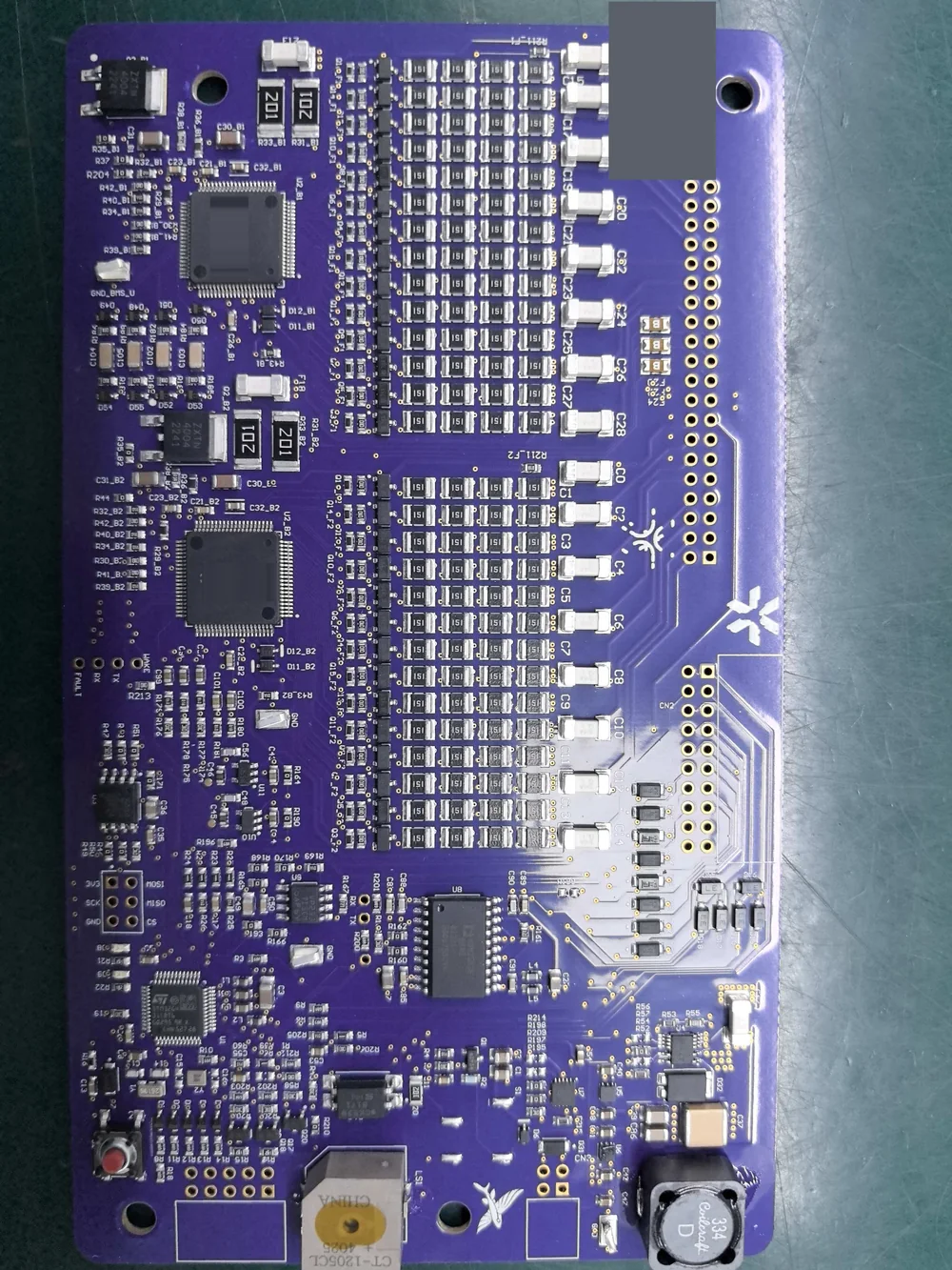 The board the article works from, fully populated: the repeating channel blocks and the control circuitry that drives them.